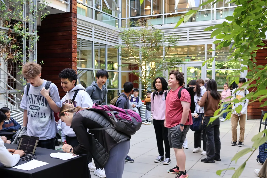 Attendees checking in to the event in the courtyard